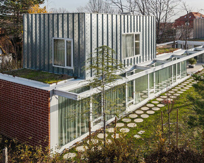perforated brick facade clads horizontal double villa bukovac by njiric+ arhitekti in zagreb