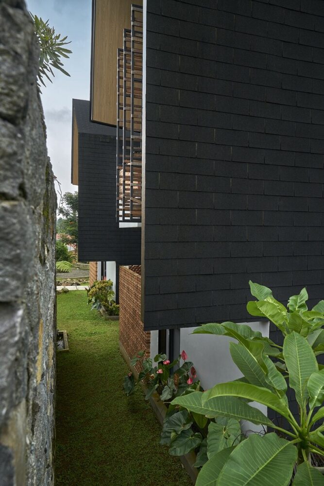 combination of black tone roof, wood, and stone wall