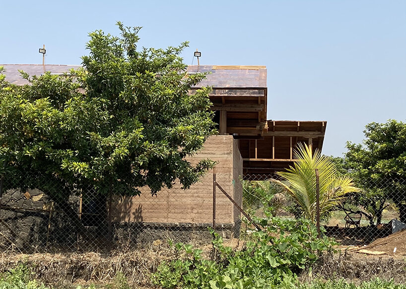 farmhouse amongst chickoo trees