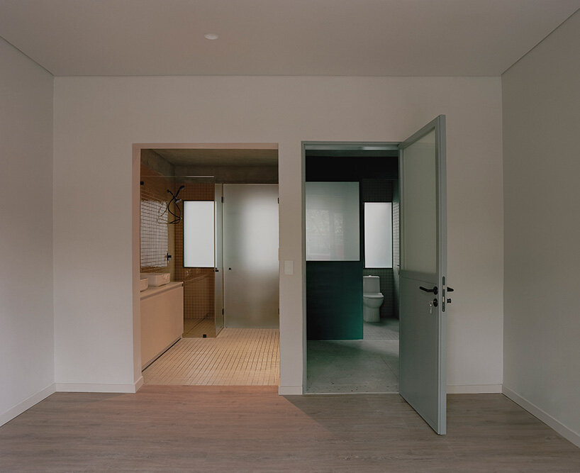 unlike the project’s signature green, the bathroom uses a contrasting color scheme