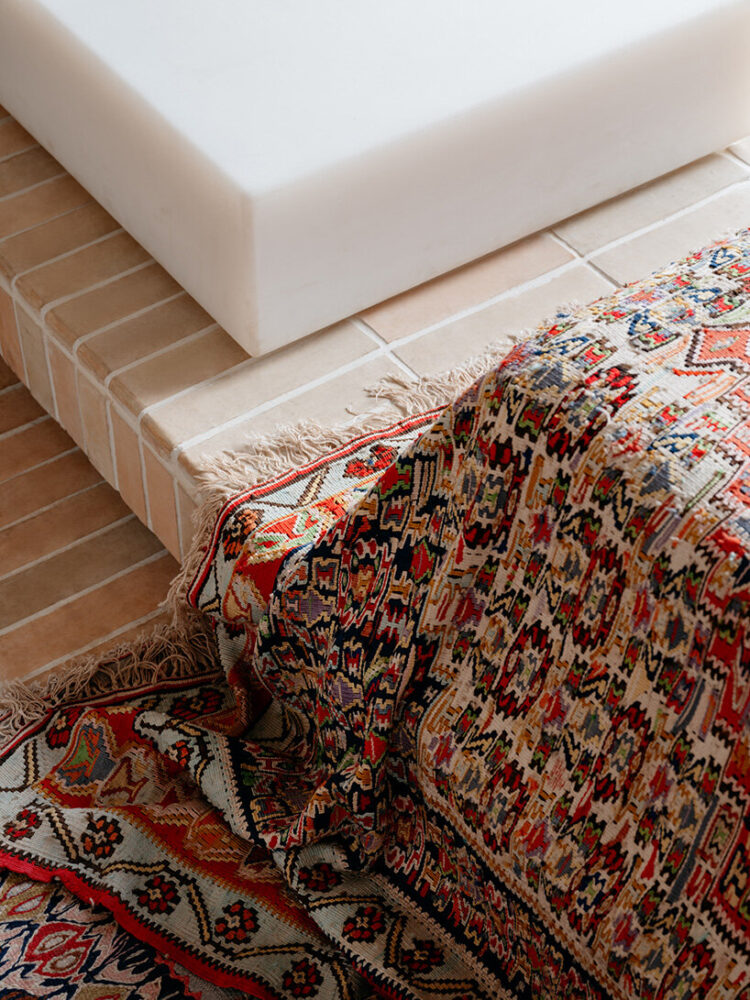 the 140-square-meter space retreats quietly into its site