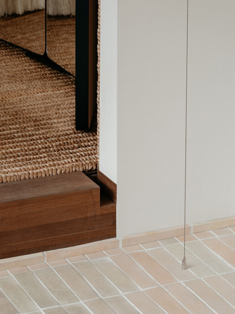 from bamboo floors and curtains to stone textures evoking the woven tactility of bamboo