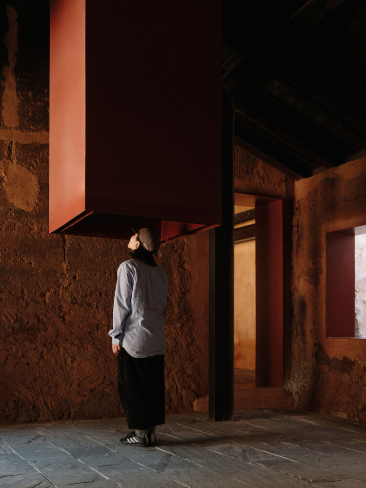 the well is connected to the dormer window of the old house