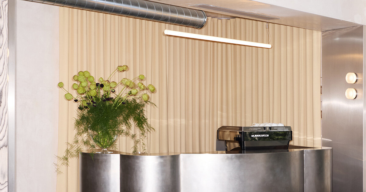 RDZ studio sculpts soft futurism into zurich café with floating