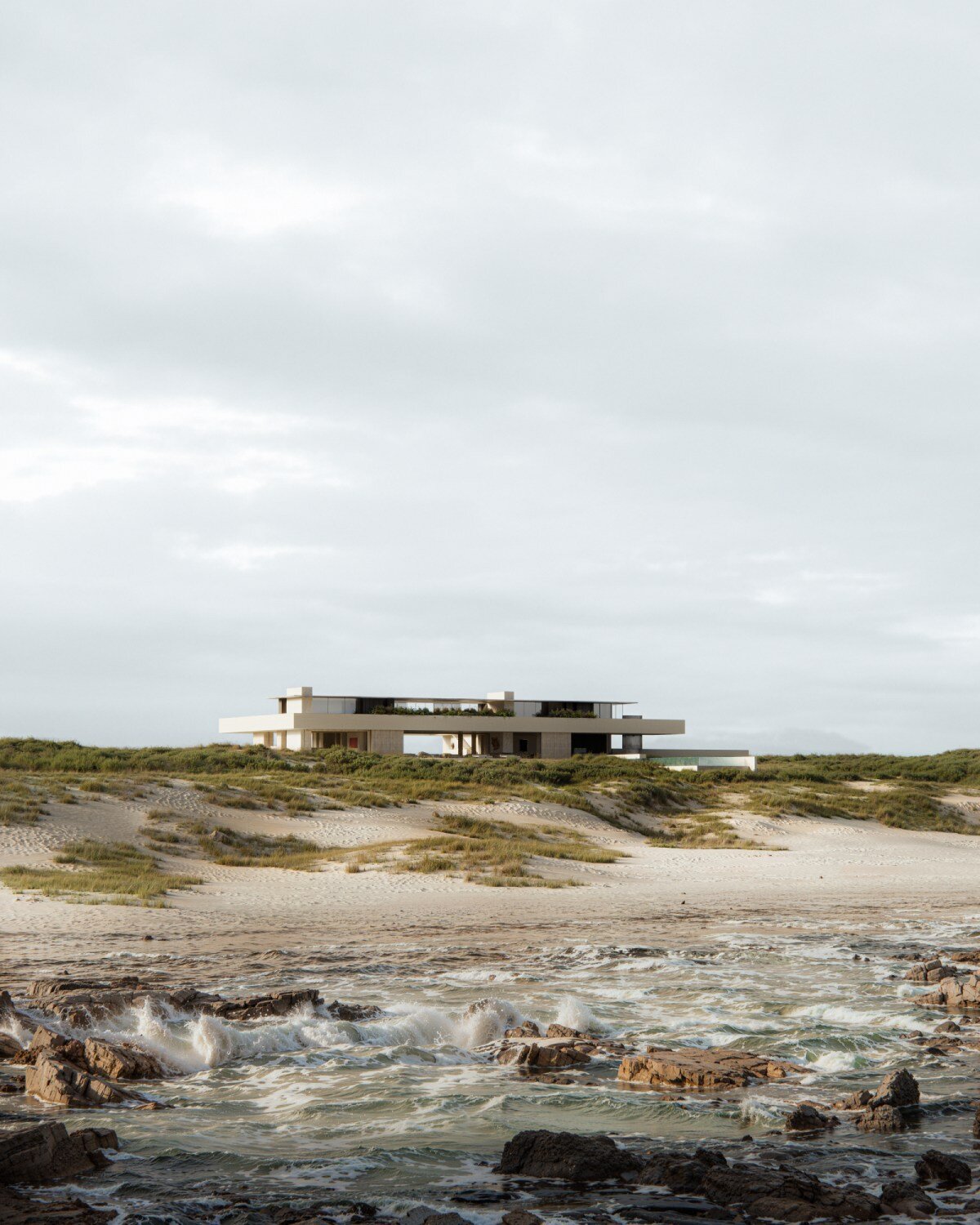 grounded timber planes shape studio JVW's house along south africa's coast