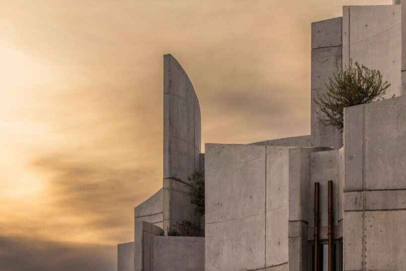 davide macullo's veterinary clinic hides behind a cluster of concrete curves in albania