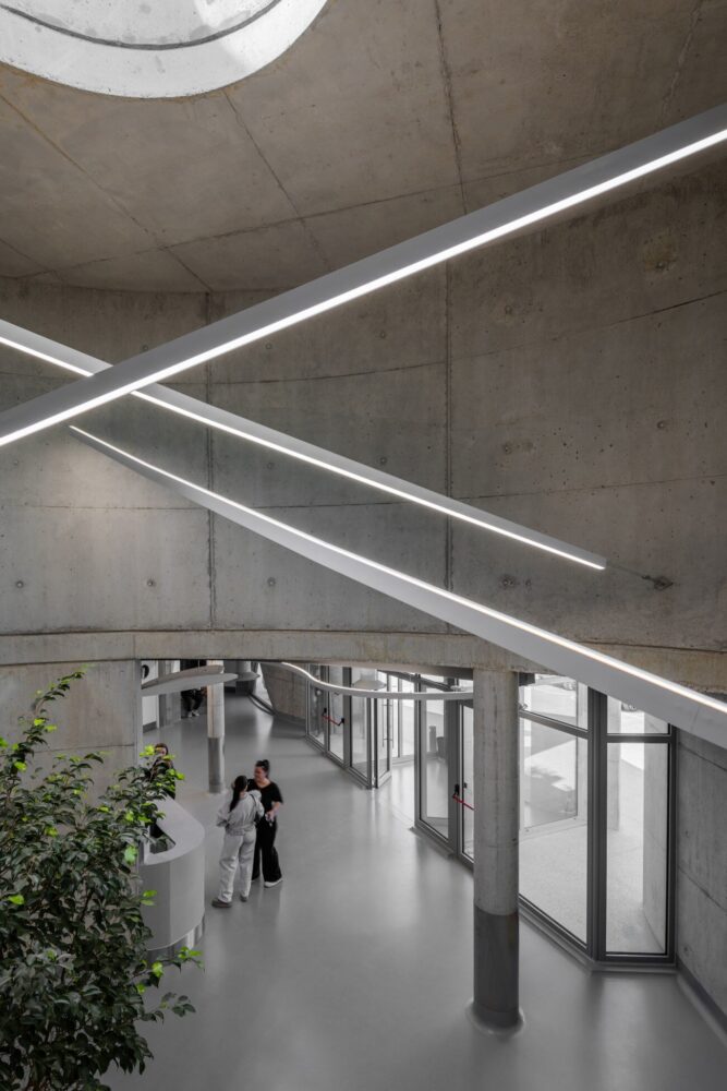 davide macullo's veterinary clinic hides behind a cluster of concrete curves in albania