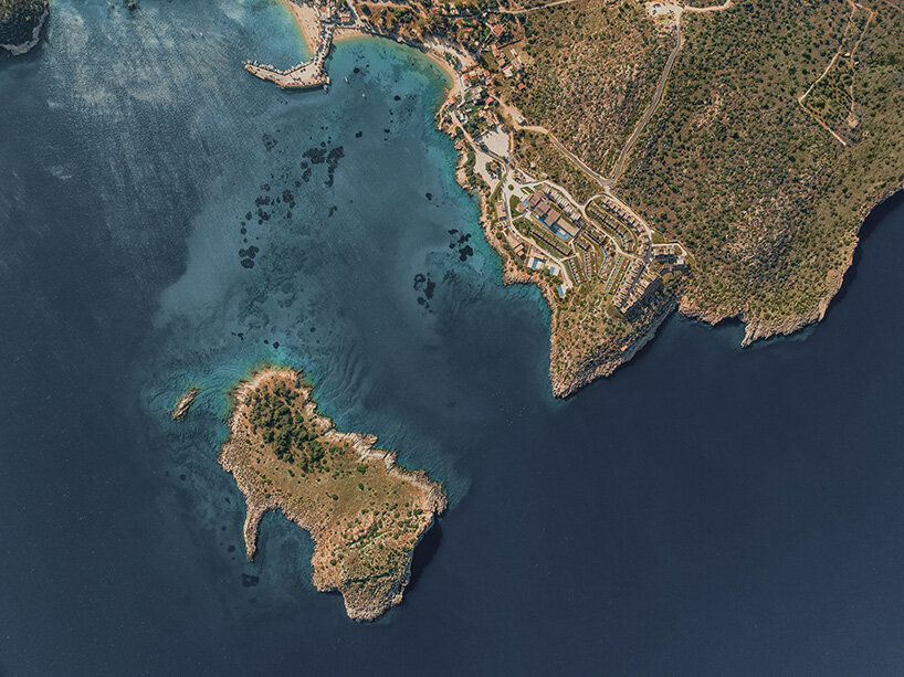 the 13,600-square-meter development is designed to follow the natural terrain