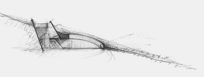 the only visible elements are the retaining wall along the linear cut and the sunken circular plaza