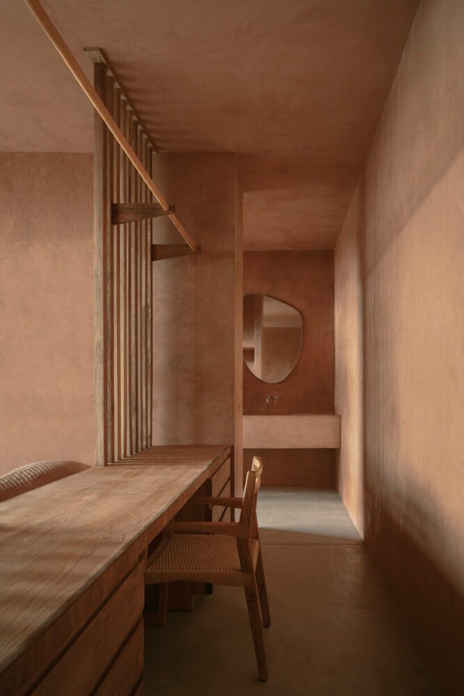 the use of stone and concrete lends a tactile quality to interior surfaces