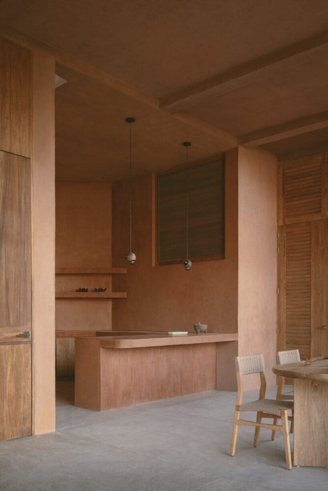 reddish-toned concrete surfaces bring warmth and depth