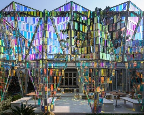 iridescent panels evoke gemstones at BBWORKSPACE’s thailand café, refracting shifting hues