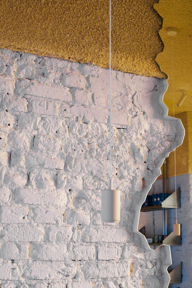 the tactile irregularity and golden hue of the ceiling suggest seafoam and morning sun