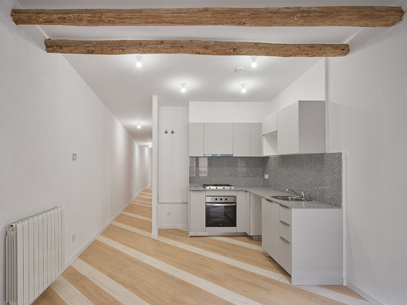 reconfiguring the interior into a series of open, light-filled spaces