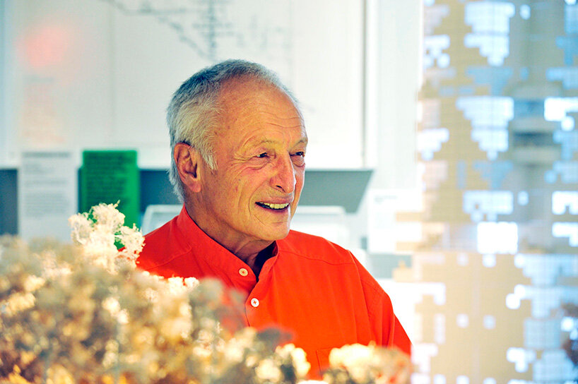 Richard Rogers stands alongside one of his models | image by PA Images | Alamy Stock Photo