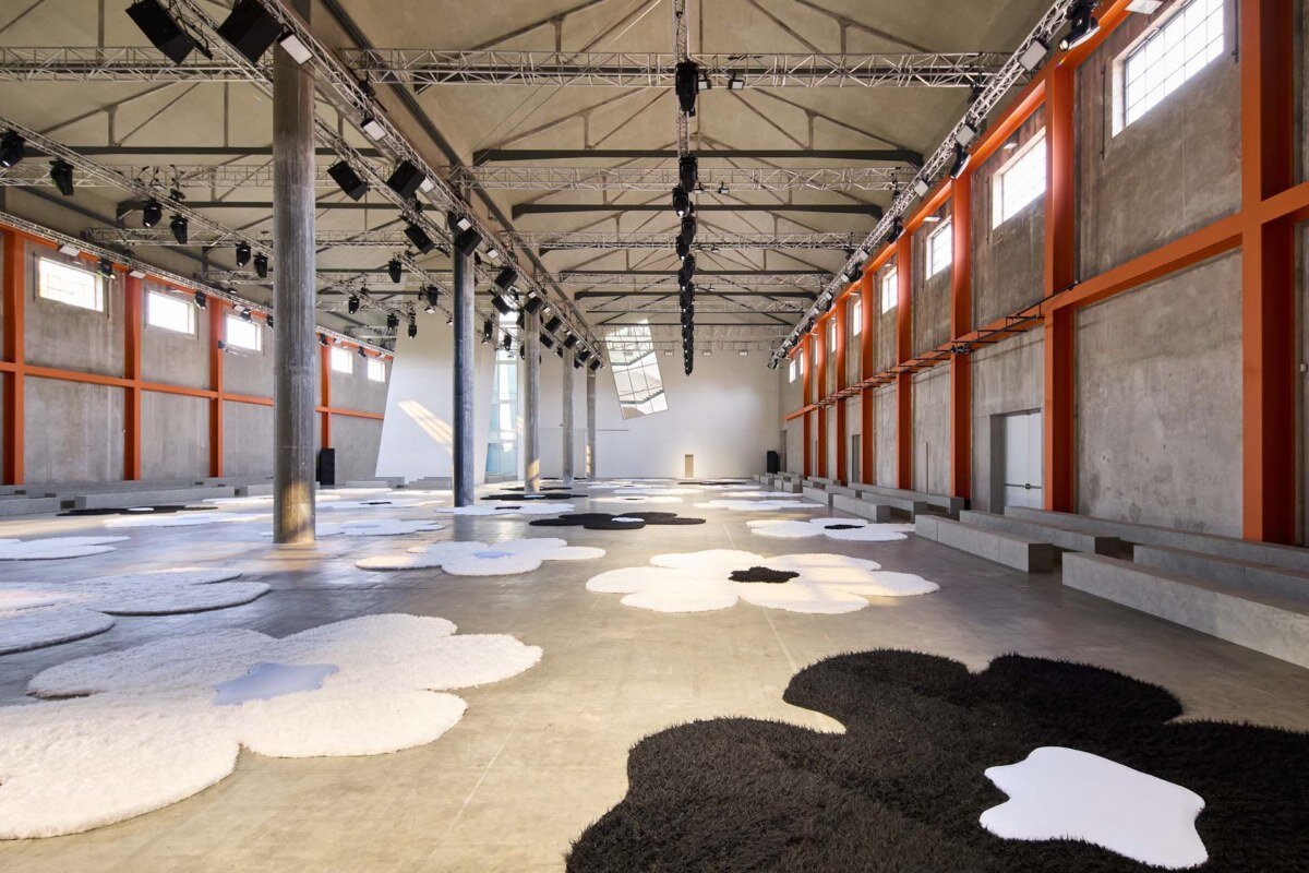 flower carpet islands by OMA bloom across prada's ss26 menswear showcase in milan