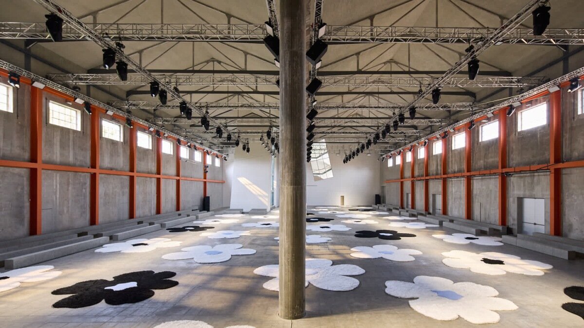 flower carpet islands by OMA bloom across prada's ss26 menswear showcase in milan