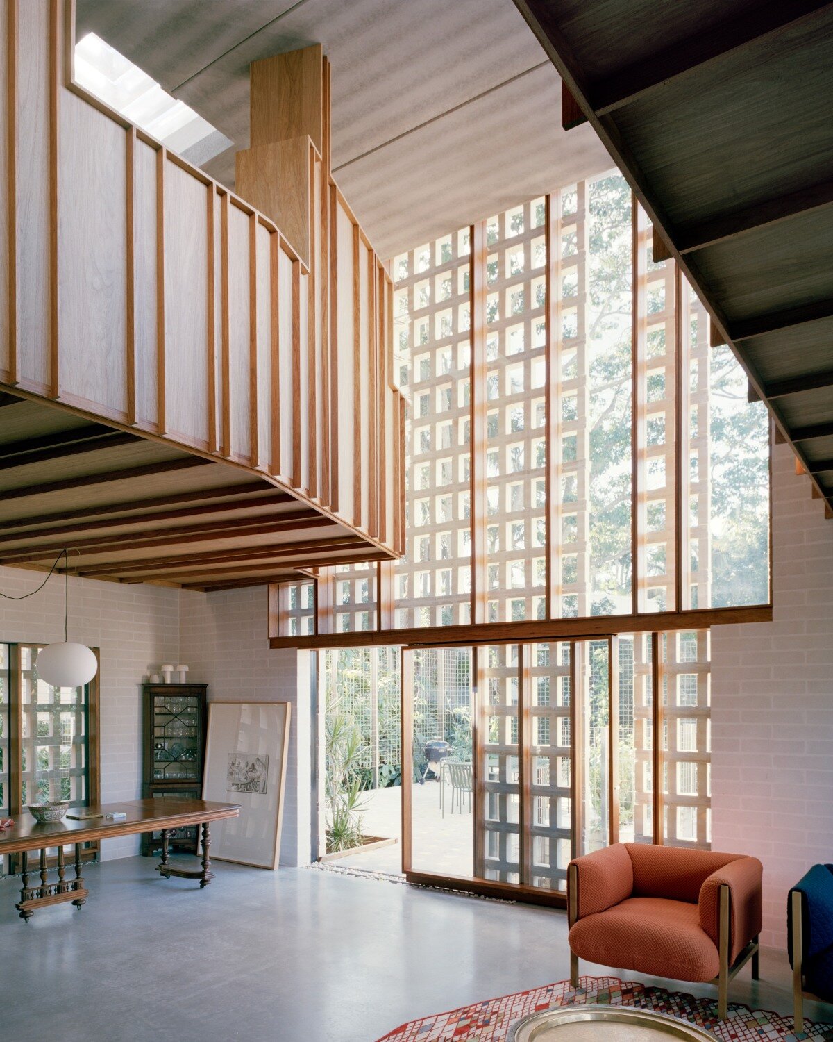 salvaged terracotta, bricks, and metal nets wrap around peter besley's australian house