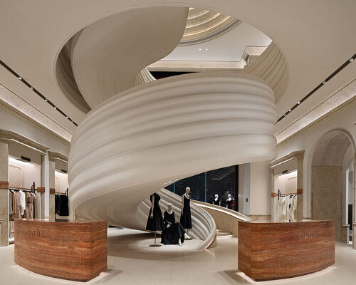 chongqing flagship’s theatrical interiors by liang architecture evoke silk drapery in motion