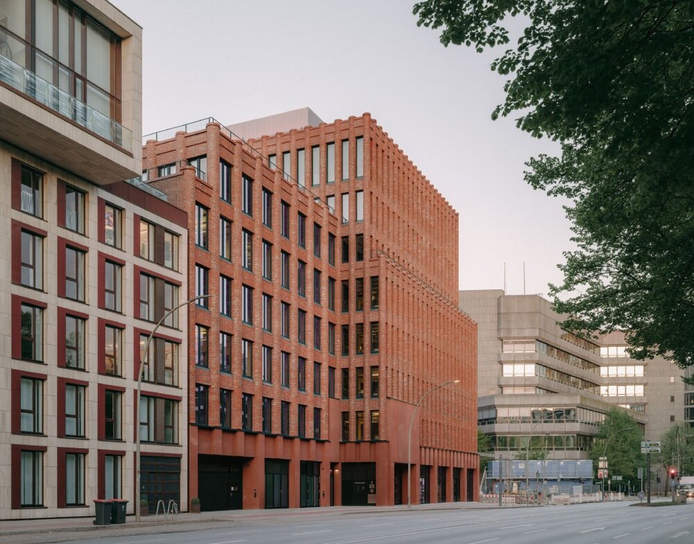 semi-circular red bricks clad christ & gantenbein's hamburg complex in rhythmic pattern
