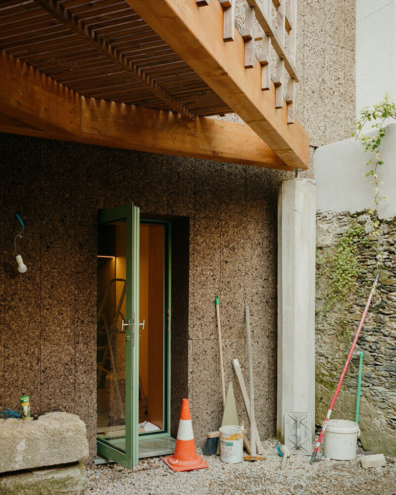 outside, the cork facade is left exposed