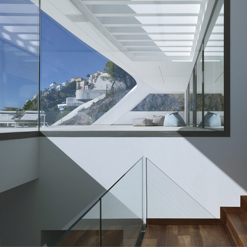 a triple-height lobby creates a dramatic entrance transition from outside to inside