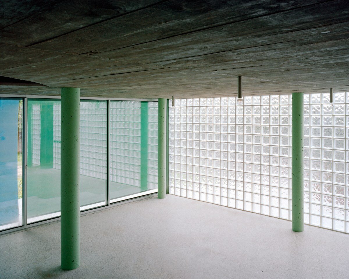 fala atelier inverts the sloped roof with slants and curves for this sculptural home in portugal