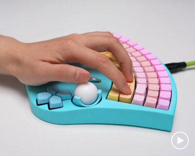fan-shaped keyboard with built-in mouse lets users type with one hand