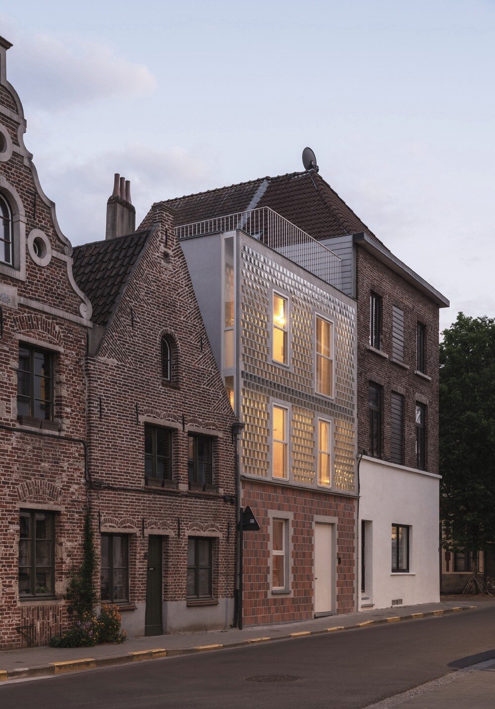 delmulle delmulle's gradient brick facade shifts from terracotta to glass in amsterdam townhouse