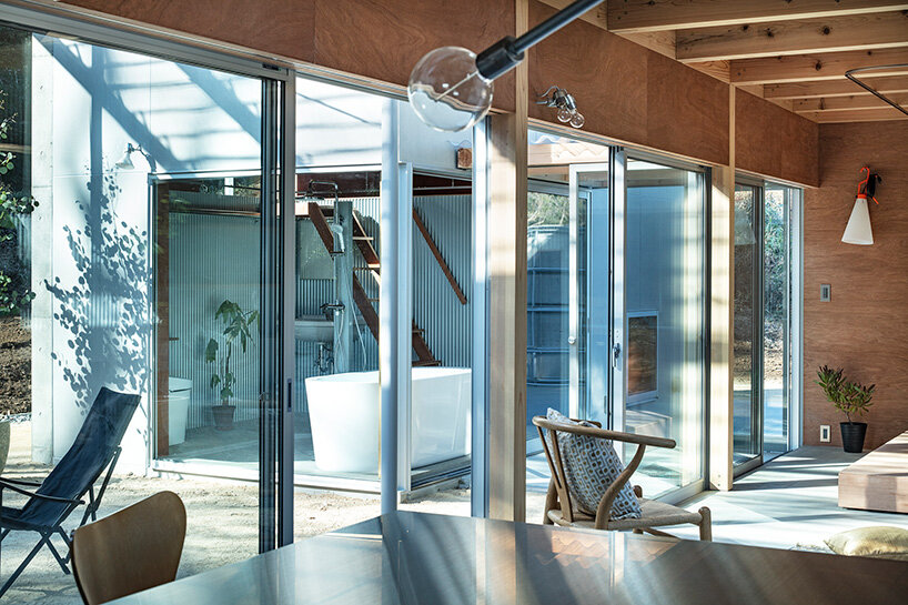 spaces are held together under one thin, extended roof