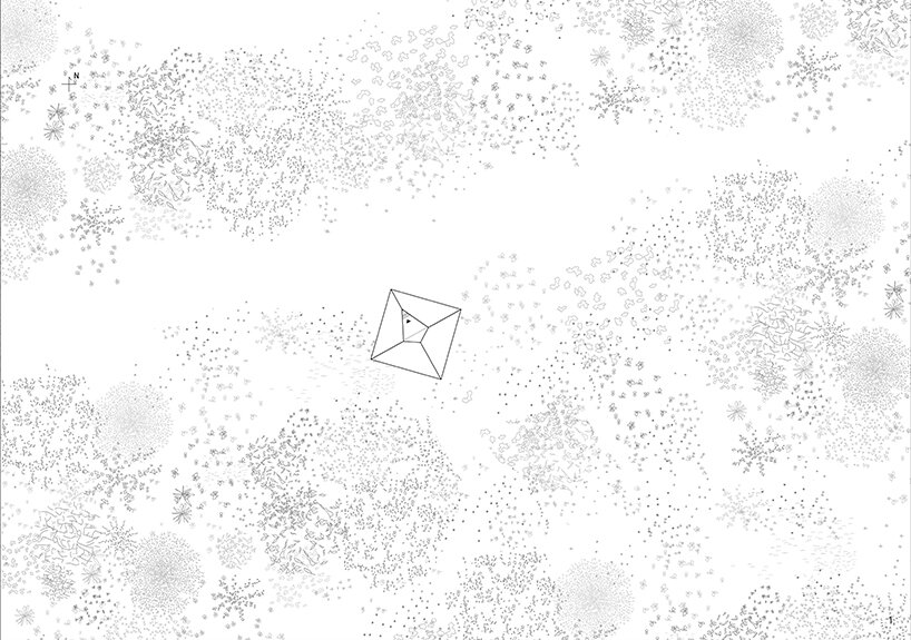 the cabin is perched under the shade of trees, beside the path