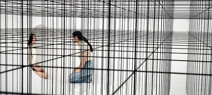 the installations are linked through translucent corridors