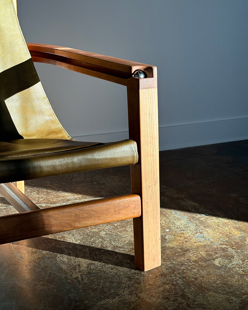 steel ball set into armrest of tanuvi hegde's 'reflect' chair for fidget-friendly design - 2