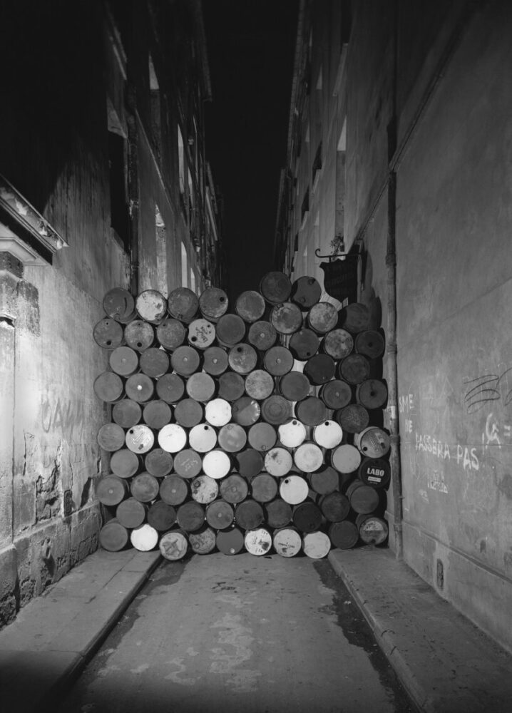 Christo and Jeanne-Claude, Wall of Oil Barrels—The Iron Curtain, Rue Visconti, Paris, 1961-62, Paris, 1962 | photo by Jean-Dominique Lajoux © 1962 Christo and Jeanne-Claude Foundation
