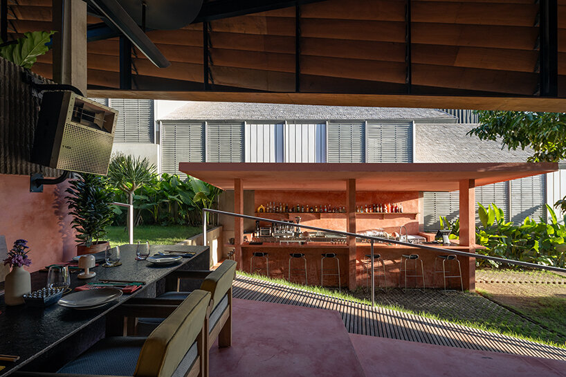 a satellite bar is positioned in harmony with the site's natural contours