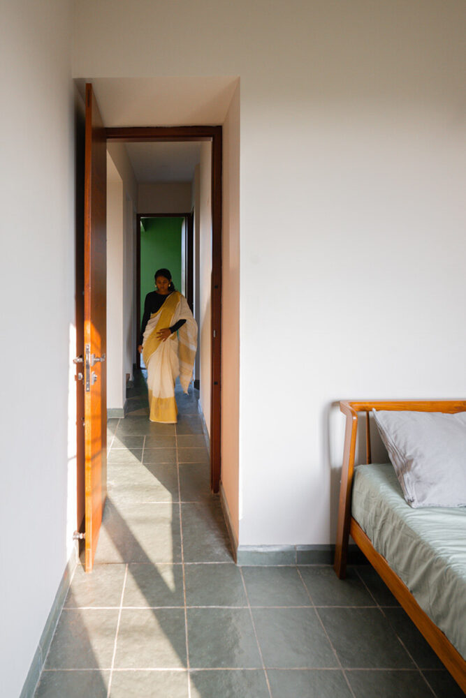 the bedrooms, though compact, are detailed with yellow triangular insets on the floors