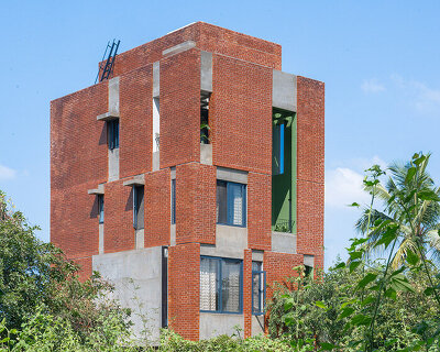 studio ShoulderTap contrasts brick and stone to shape family residence in india