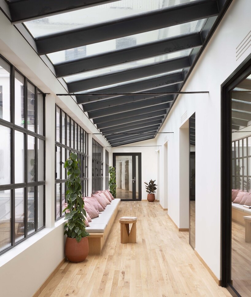 this atrium, once a formal courtyard, is now enclosed with a glass roof