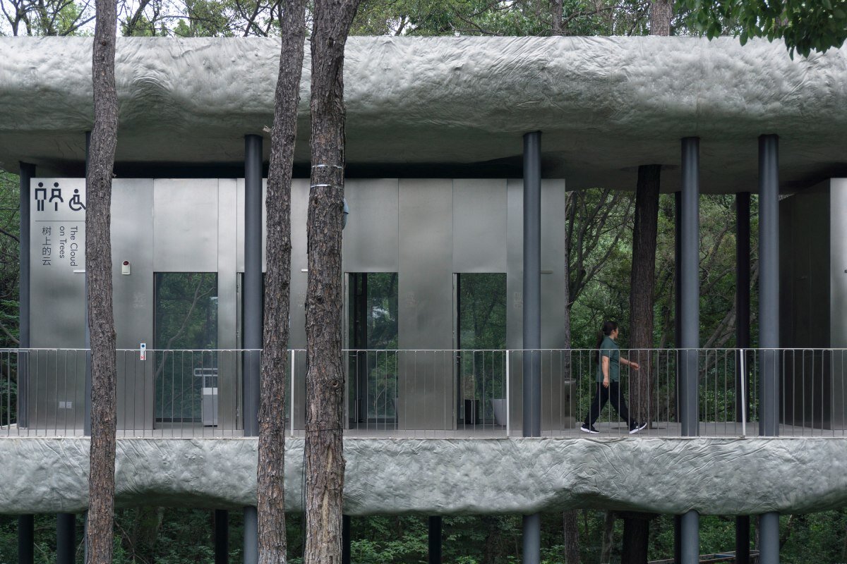 WUWU atelier's restrooms perch like concrete clouds and cavernous crevices in china forest