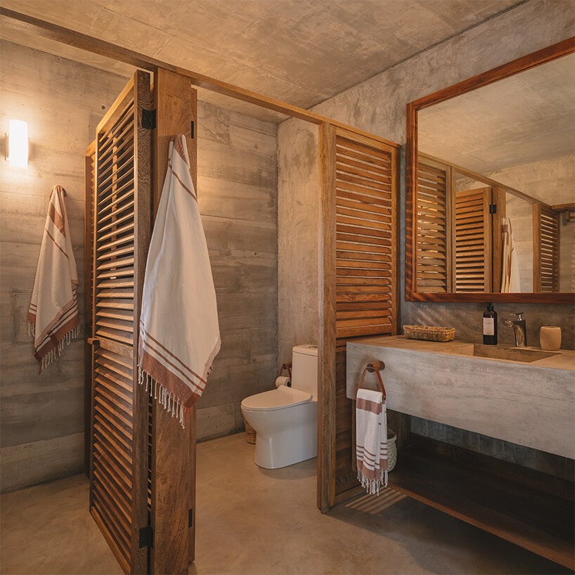 the bathrooms are conceived as simple spaces built to last