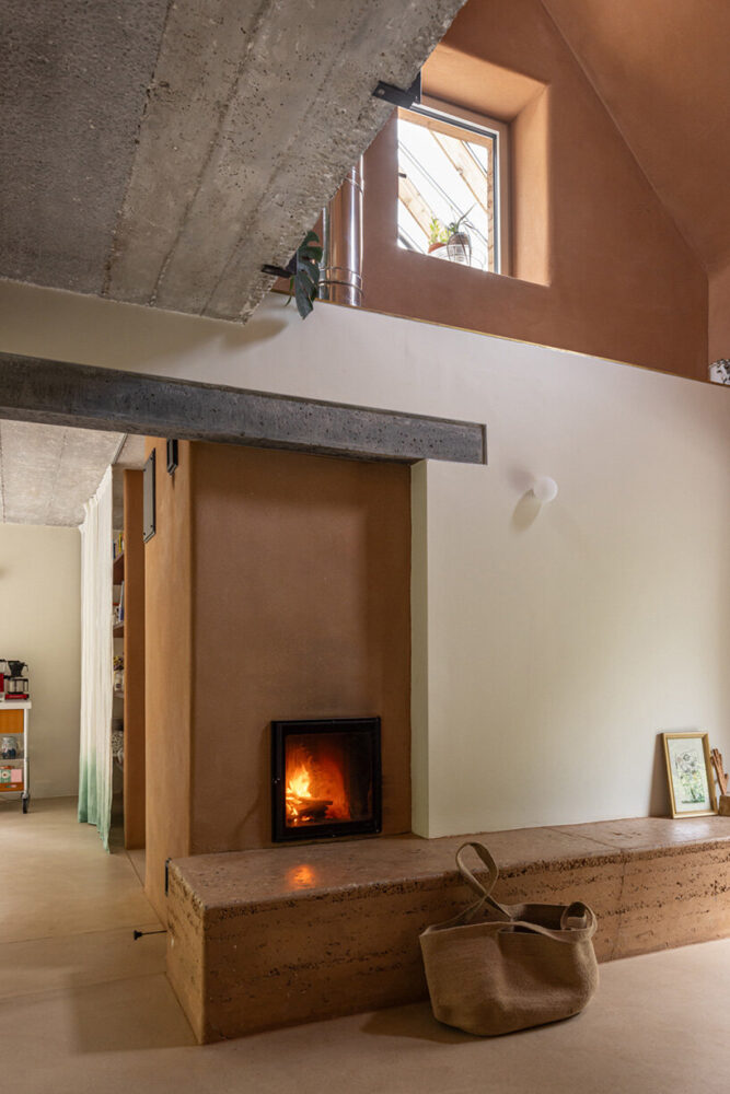 a communal earthen stove keeps the house warm