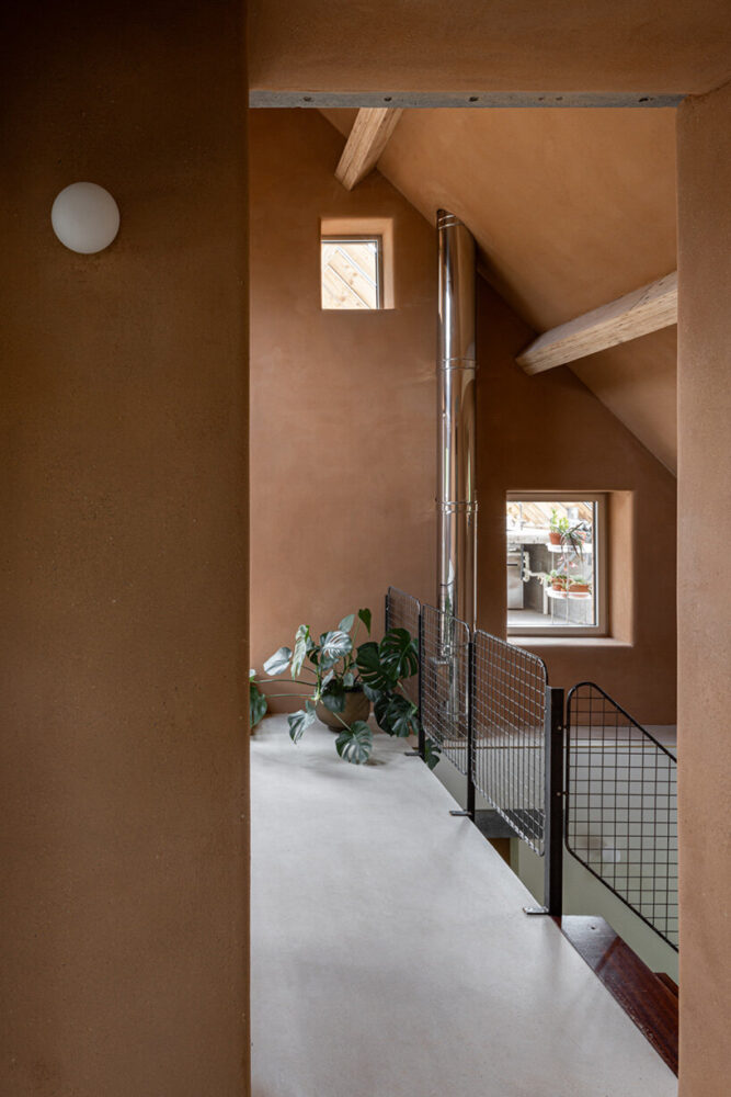 the earth wall retains solar warmth in winter while helping cool the space during hot days