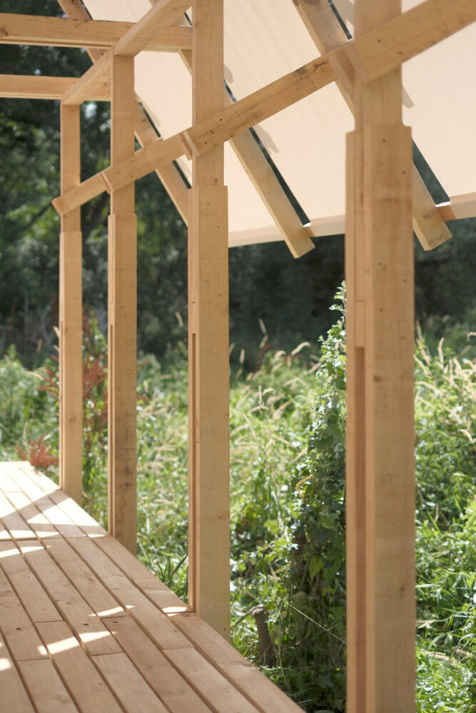 a southern facade opens to the river