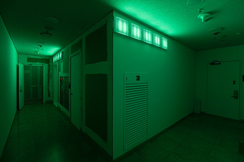 exit signs glow as ambient lighting