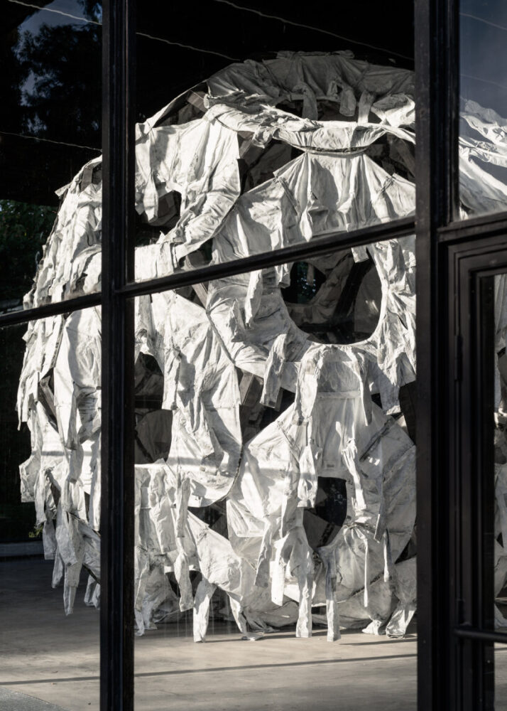 view of Three Perfectly Proportioned Spheres and Camouflage Uniforms Painted White