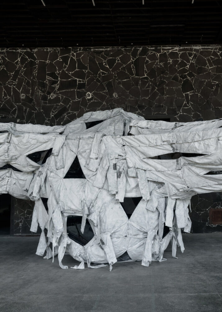 view of Three Perfectly Proportioned Spheres and Camouflage Uniforms Painted White