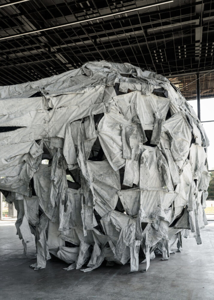 the painted war uniforms bring forth the symbols of war and actual conflict taking place in the country