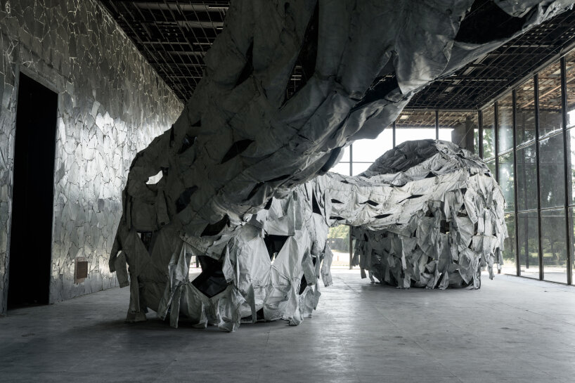 view of Three Perfectly Proportioned Spheres and Camouflage Uniforms Painted White