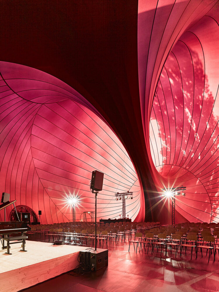 the interior reveals the hall’s design logic, engineering, and conceptual foundations