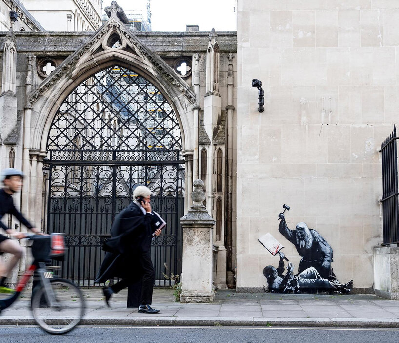 banksy is back: new stencil artwork appears at the royal courts of justice in london